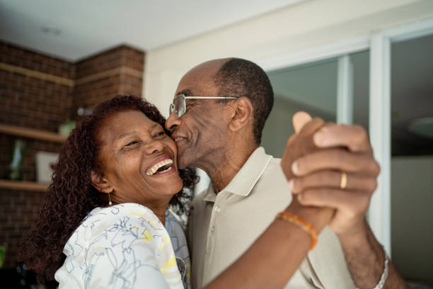 Joyful Black senior couple sharing a loving moment